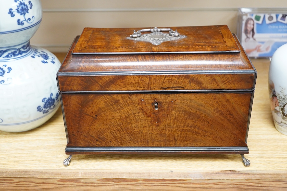 A George III and later flame mahogany veneered writing box raised on ball feet, 30cm wide
